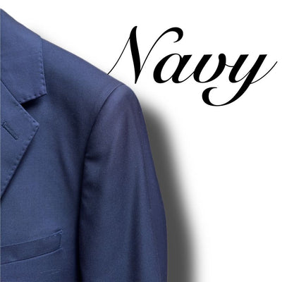 Close-up of the left side of a Paul Betenly Solid Suit - Slim Fit blazer in navy, featuring "Navy" in cursive on a white background.