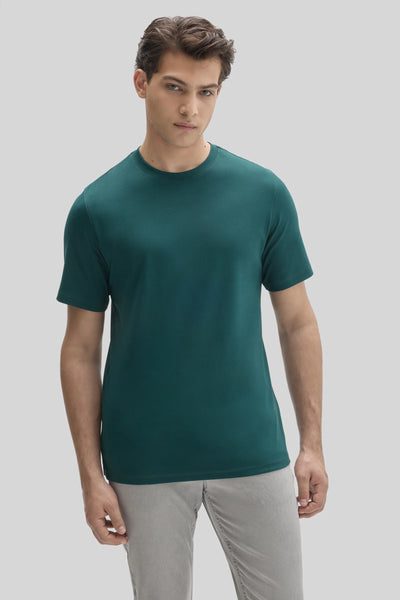A man wearing a dark green, dressy Robert Barakett Tee Shirt Georgia Crew 23336 Pima cotton T-shirt.