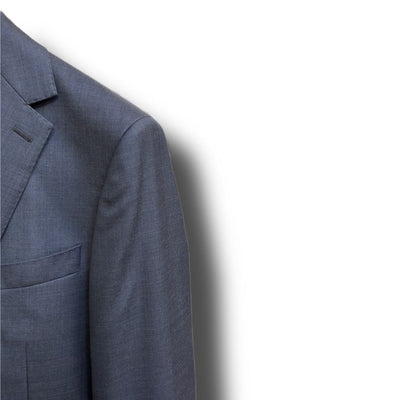 A close-up of the upper left part of a Paul Betenly Solid Suit - Slim Fit jacket in gray, showing the lapel, shoulder, and pocket against a white background.