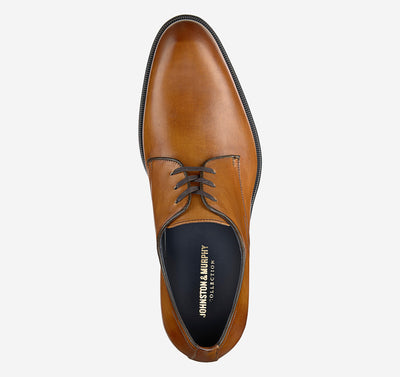A single Johnston & Murphy Flynch Plain brown leather oxford dress shoe with black laces, seen from above, showcases an Italian hand-stained upper and a black insole labeled Johnston Murphy.