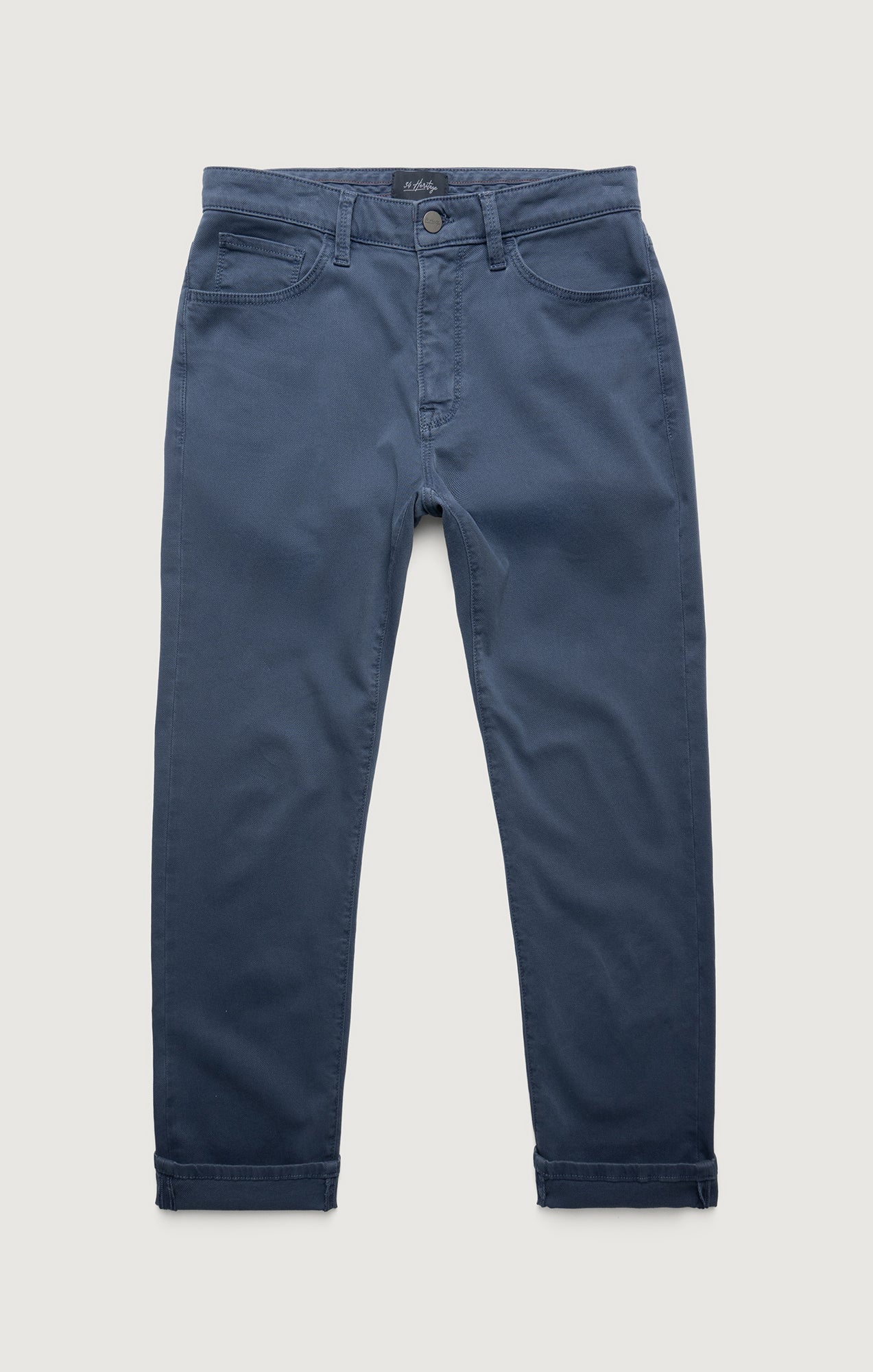 Blue jeans on a light gray background