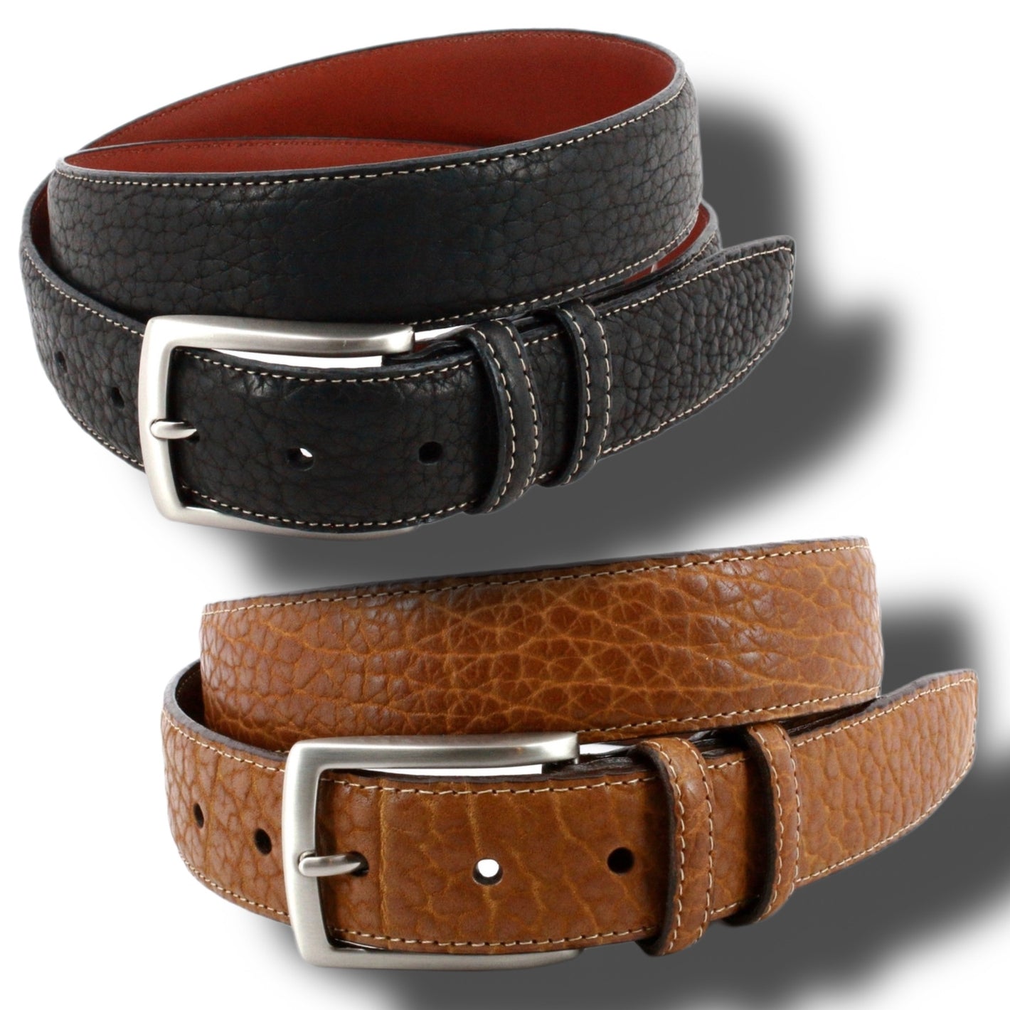 Two Torino American Bison Belts—one black, one brown—with silver buckles and visible stitching, coiled on a white background with shadows. Crafted by Torino for quality and style.