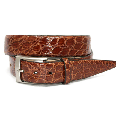 The Torino Glazed South American Caiman Belt Big & Tall by Torino features brown caiman leather with a satin nickel buckle, rolled up and set against a plain white background.