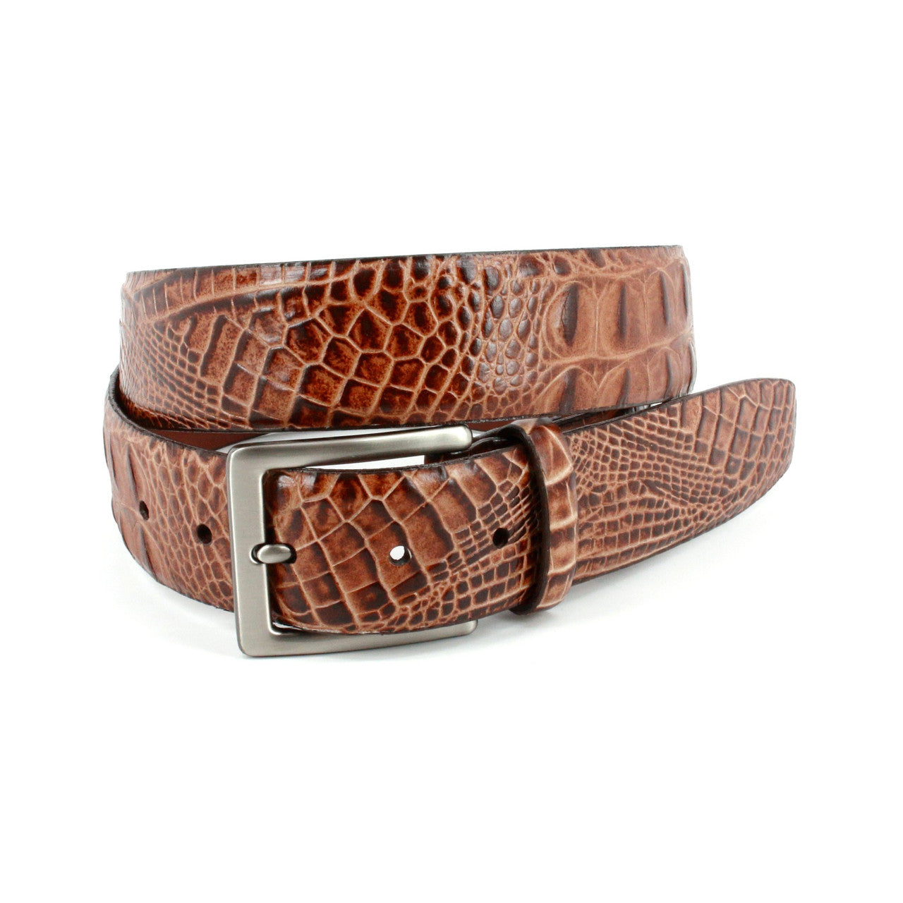 The Torino Hornback Crocodile Embossed Calf Belt by Torino features a silver rectangular buckle and an elegant crocodile texture, coiled in a loose loop on a white background. Made from genuine leather for a refined look.