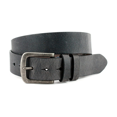 The Torino Distressed Waxed Harness Leather Belt by Torino features black distressed leather and a silver metal buckle, coiled on a white background—an effortlessly stylish casual belt proudly made in the USA.
