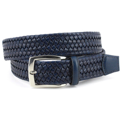 A coiled Torino Italian Woven Stretch Leather Belt in navy blue with a silver buckle, displayed on a white background.