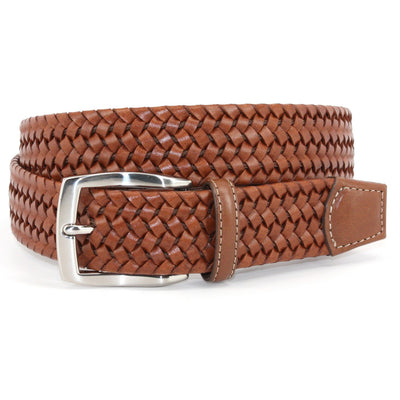 A Torino Italian Woven Stretch Leather Belt by Torino, made from genuine leather with a silver buckle, is coiled neatly on a white background.