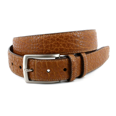 Tan Torino American Bison Belt by Torino, featuring a silver buckle, textured surface, and multiple adjustment holes, coiled on a white background.