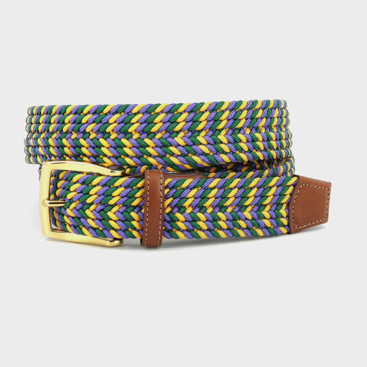 The Torino Italian Braded Stretch Belt Mardi Gras by Torino features blue, green, and yellow strands, a gold buckle, and brown glove leather lined ends.