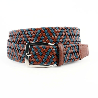 A Torino Italian Braided Leather & Linen Belt in brown and dark blue by Torino, with a silver buckle, is coiled on a white background.