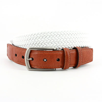 The Torino Italian Woven Cotton Elastic Belt features a white woven design with a saddle tan leather buckle strap and silver buckle, shown coiled on a white background.