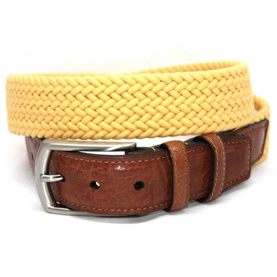 The Torino Italian Woven Cotton Elastic Belt features yellow woven cotton, a saddle tan leather end, and a silver buckle.