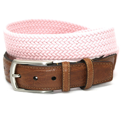 A saddle tan leather belt with a silver buckle is rolled up next to a pink Torino Italian Woven Cotton Elastic Belt from Torino.