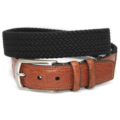 The Torino Italian Woven Cotton Elastic Belt by Torino features a brown leather buckle section and a woven black fabric strap, shown coiled in a loop.