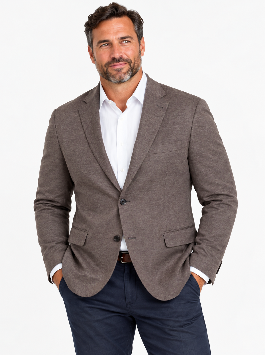 Man with a beard wears the 7 Downie St Alden Sport Coat Big & Tall, a white dress shirt, and navy trousers, standing with hands in pockets against a white background.