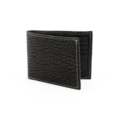 A genuine bison leather billfold wallet by Torino, featuring black textured leather with white stitching, stands upright on a white background—a classic accessory from Torino.