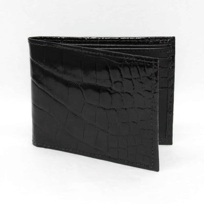 The Torino Genuine Alligator Billfold Wallet, a black bi-fold by Torino, features authentic alligator texture and is shown standing upright against a plain white background.