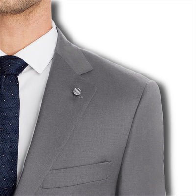 Man wearing the Hart Schaffner Marx Chicago Fit Suit Big & Tall—a grey jacket with a white shirt and navy polka dot tie—shoulders up against a white background, ideal for men’s luxury workwear.