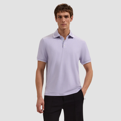 Man wearing a light purple polo shirt on a white background