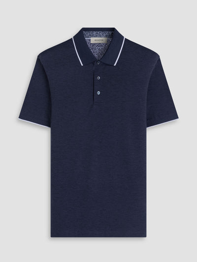 Navy polo shirt with white trim on a light gray background