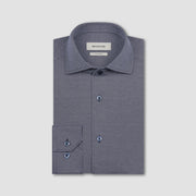Folded gray dress shirt with 'BUGATCHI' label on a light gray background