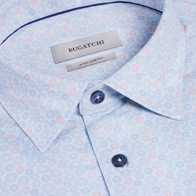 Close-up of a Bugatchi shirt with a patterned design and brand label.