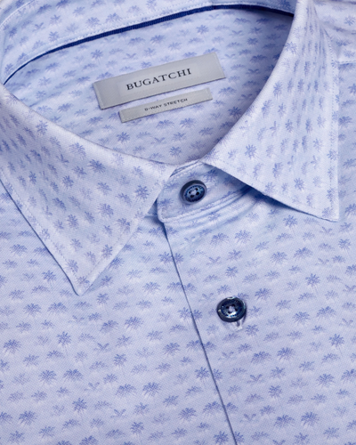 Close-up of a light blue patterned shirt with Bugatchi branding.