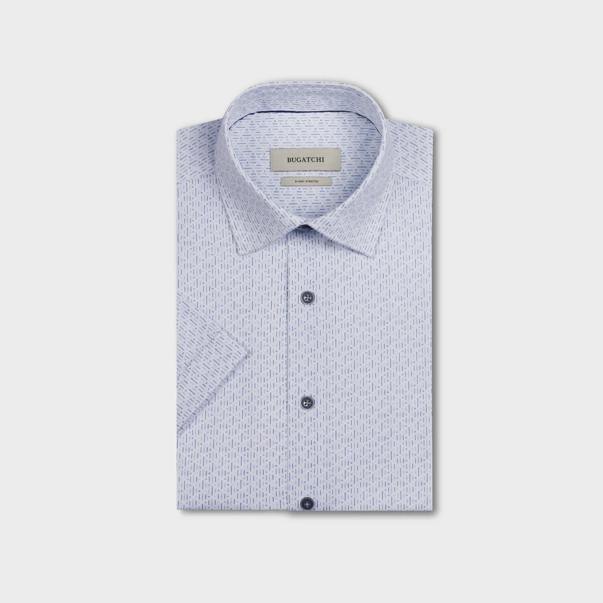 Folded light blue shirt with subtle pattern on a white background