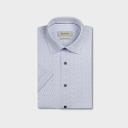 Folded light blue shirt with subtle pattern on a white background