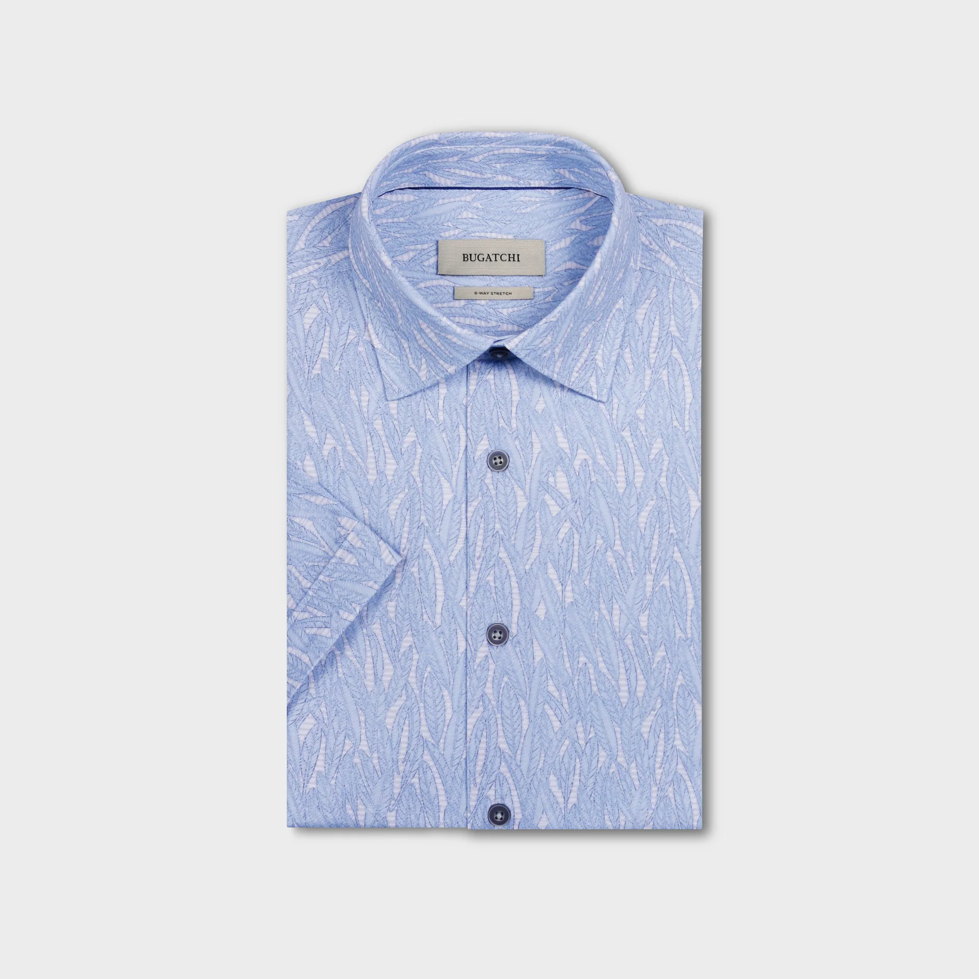 Light blue patterned shirt with short sleeves on a light gray background
