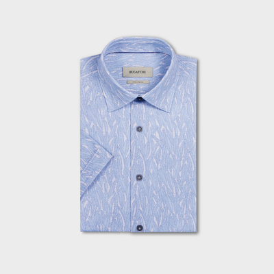 Light blue patterned shirt with short sleeves on a light gray background