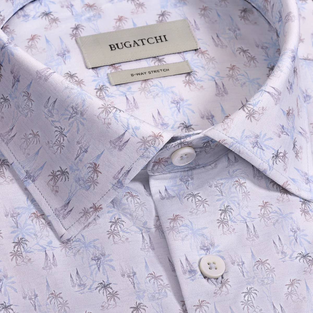 Close-up of a Bugatchi shirt with a palm tree pattern and brand labels.