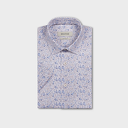 Folded shirt with blue floral pattern on a light gray background