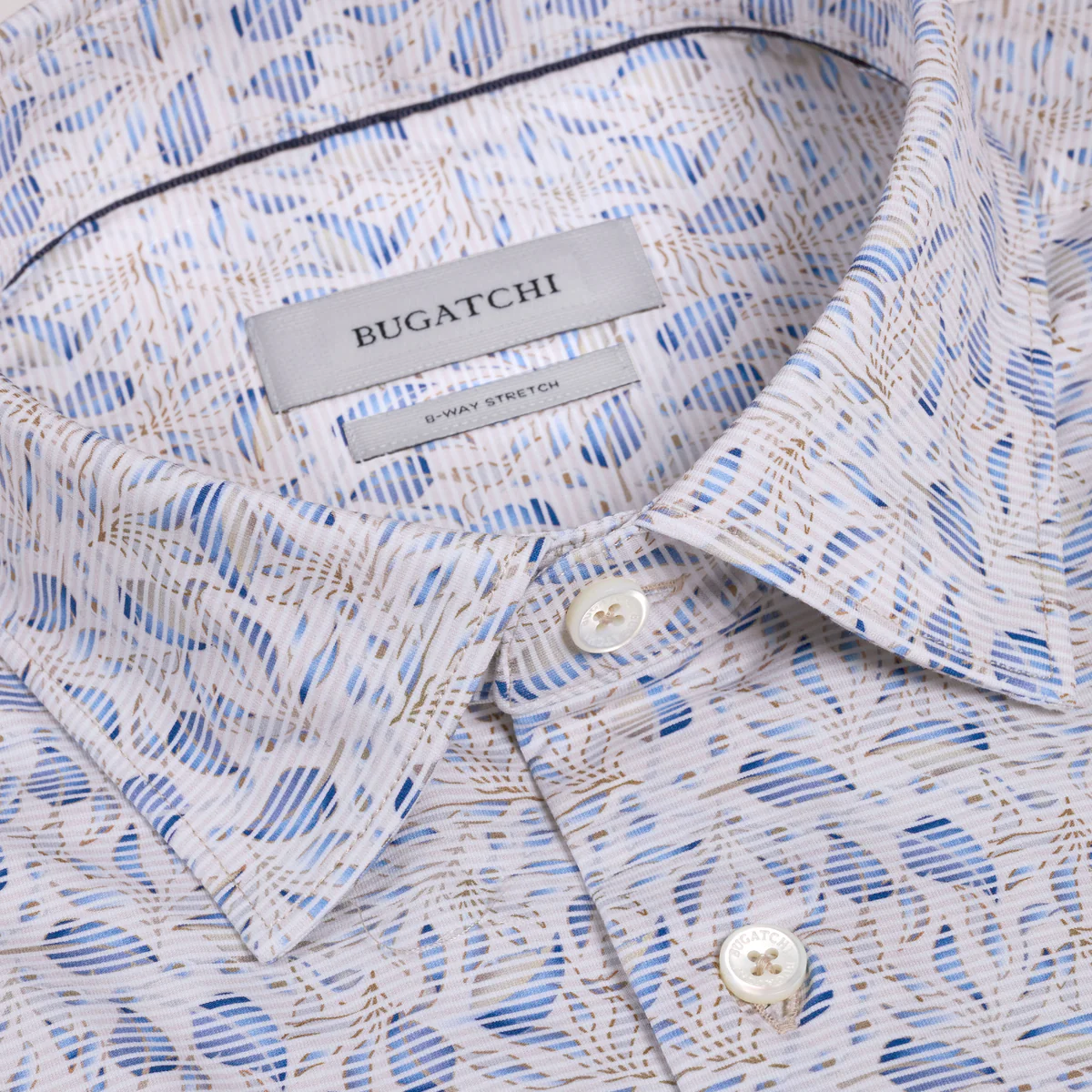 Close-up of a Bugatchi shirt with a patterned design and visible brand label.