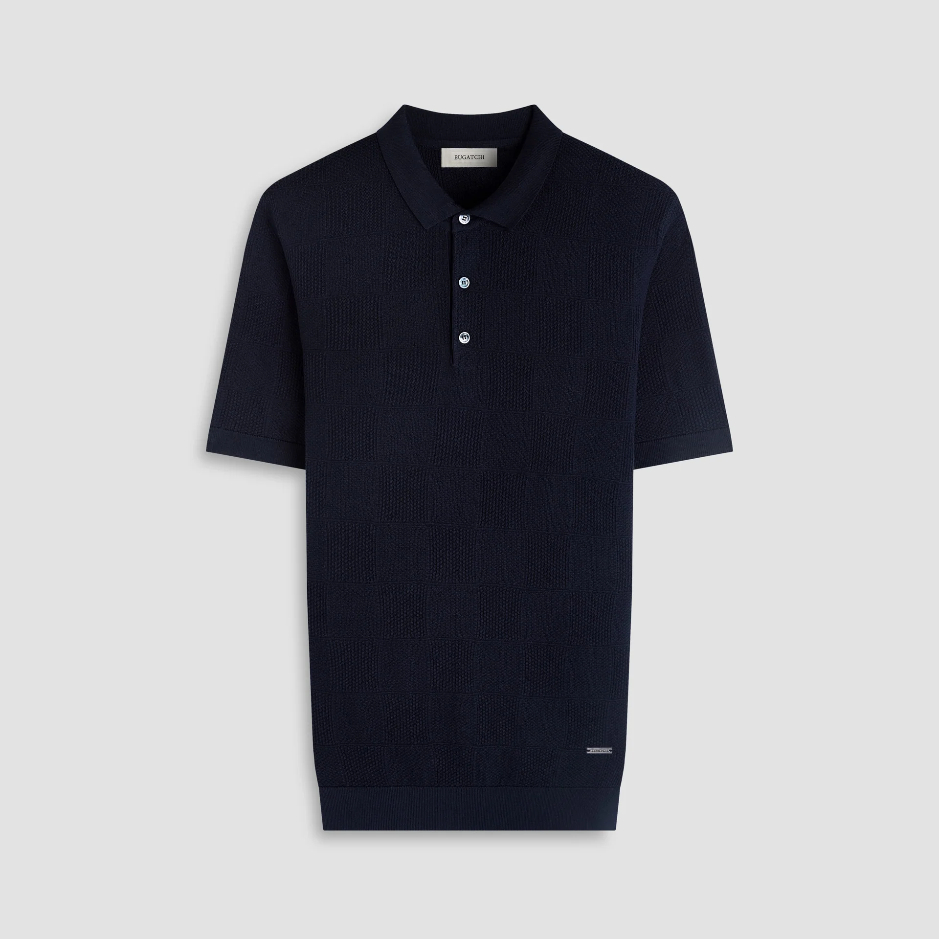 Navy blue polo shirt on a light gray background