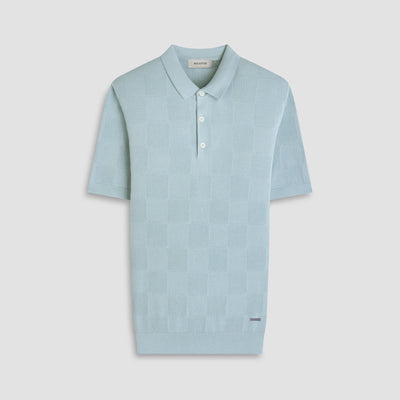 Light blue polo shirt on a light gray background