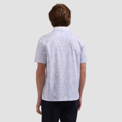 Person wearing a light blue patterned shirt on a plain background