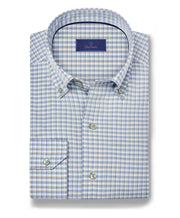 Folded blue and white checkered dress shirt on a white background