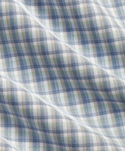 Close-up of checkered fabric with blue and beige pattern