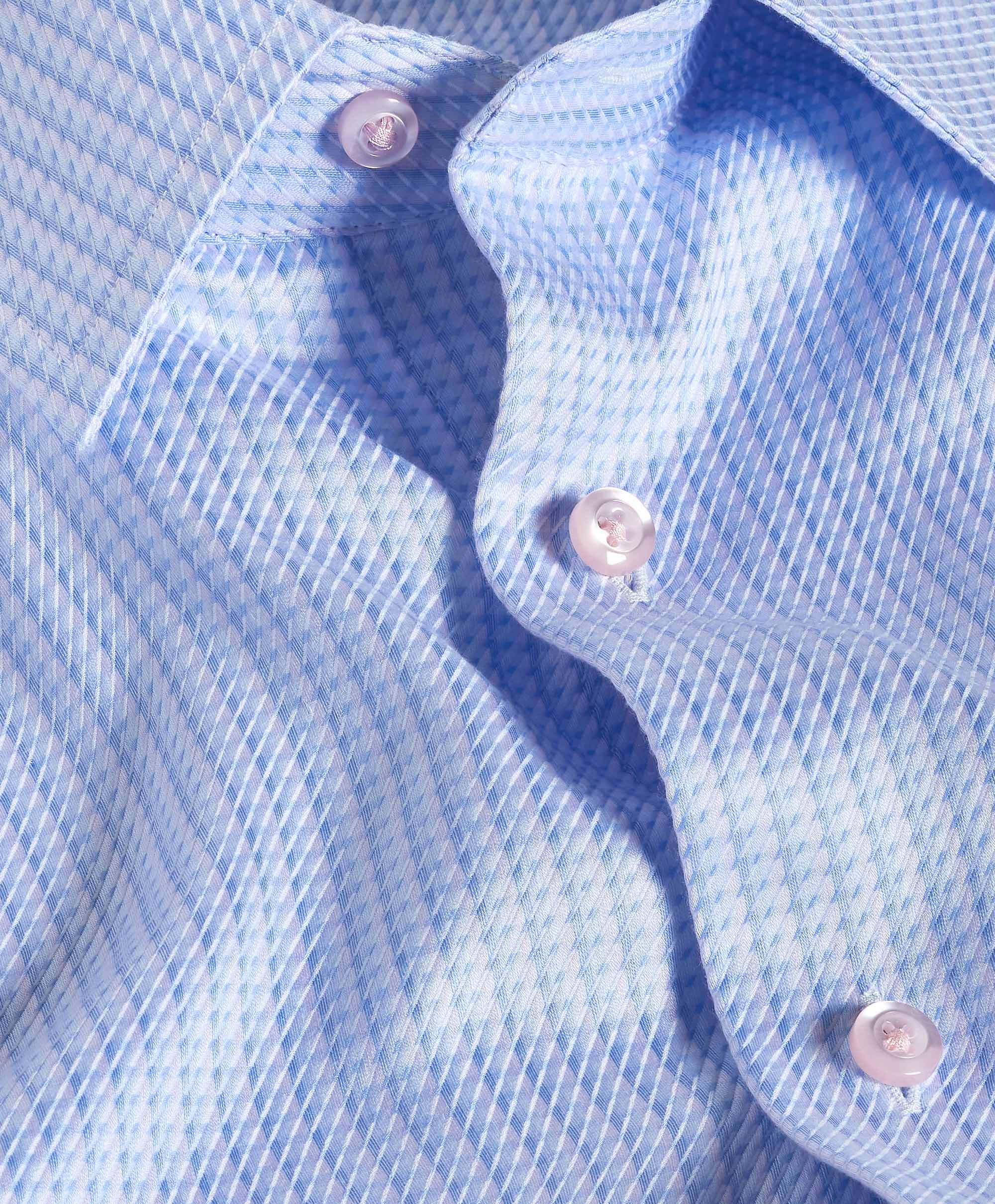 Close-up of a blue checkered shirt with buttons