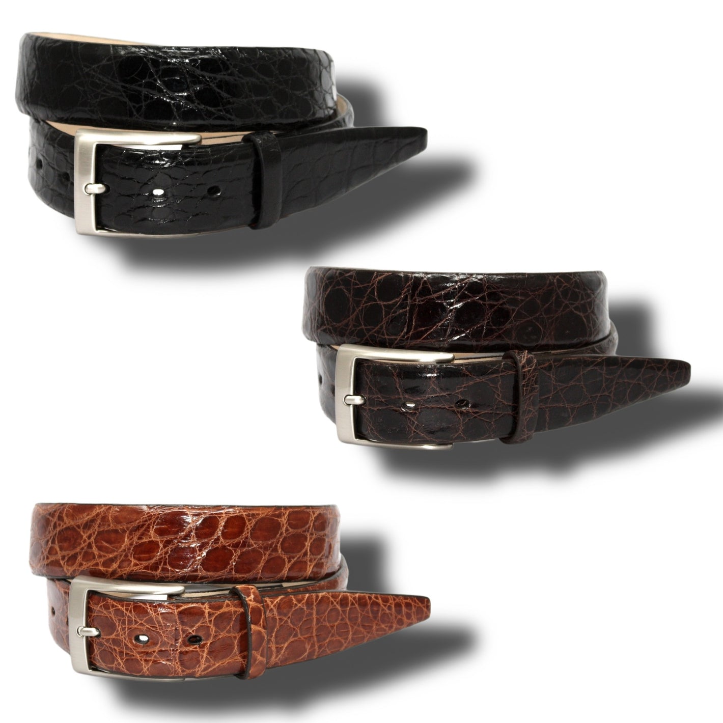 Three Torino Glazed South American Caiman Belts for Big & Tall in black, dark brown, and tan are shown on a white background. Each Torino belt features crocodile texture and an elegant satin nickel buckle for a refined look.