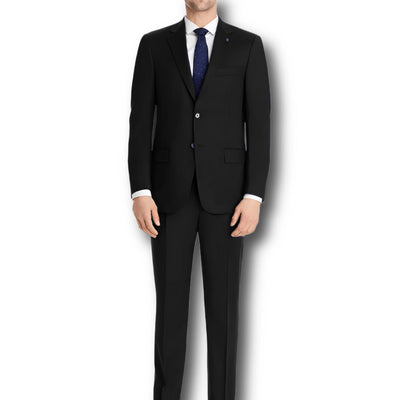 A man wears the Hart Schaffner Marx Chicago Fit Suit Big & Tall with a white shirt and dark tie, standing against a plain white background—showcasing classic luxury workwear from Hart Schaffner Marx.