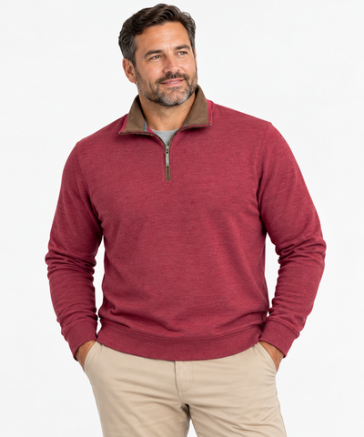 Man wearing F/X Fusion Men’s Big & Tall Burgundy 1/4 Zip Sweater with a tan collar and beige pants, standing with hands in pockets against a light background.