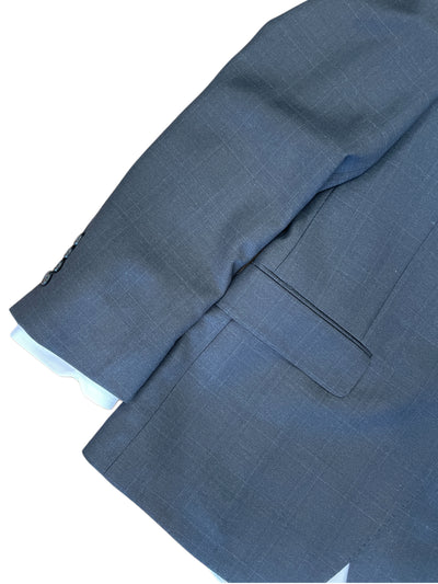 Close-up of a blue suit jacket on a white background