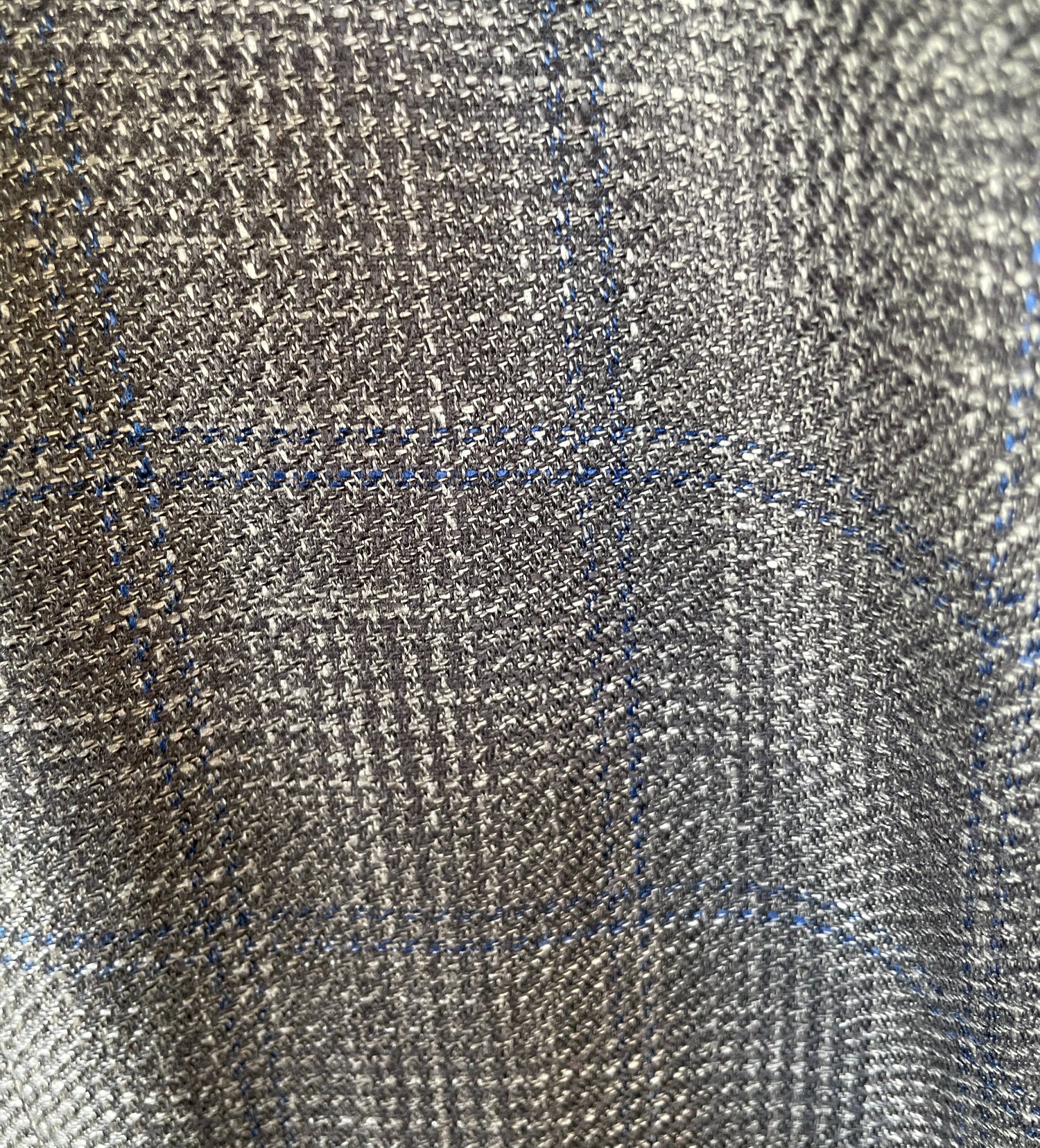 Close-up of textured fabric with a check pattern
