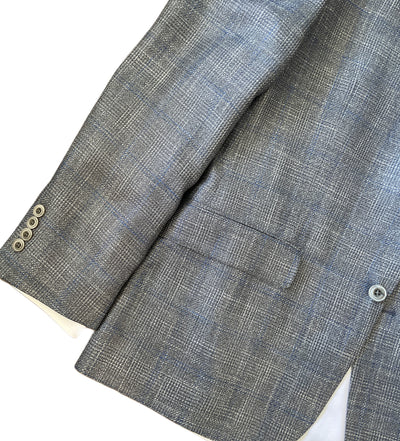 Gray checkered suit jacket with button details on a white background