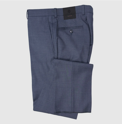 The Jack Victor Riviera Traveler Pants are folded blue wrinkle-resistant trousers with a back pocket, belt loops, and a black Jack Victor brand tag near the waistband.