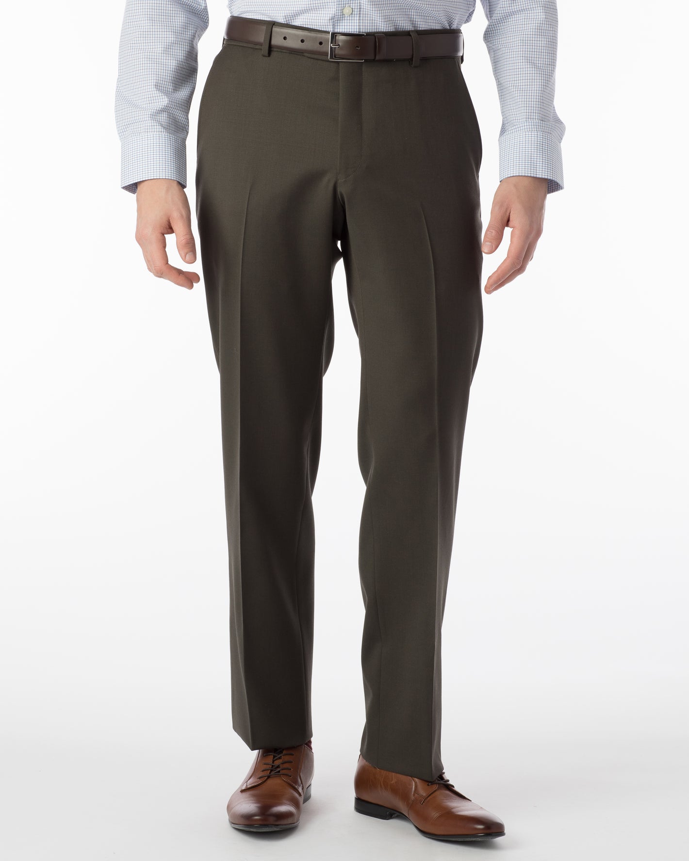 A man wearing Ballin Super 120's Comfort-EZE Big & Tall dress pants in Loden by Ballin, a light blue checkered shirt, and brown dress shoes stands against a white background.