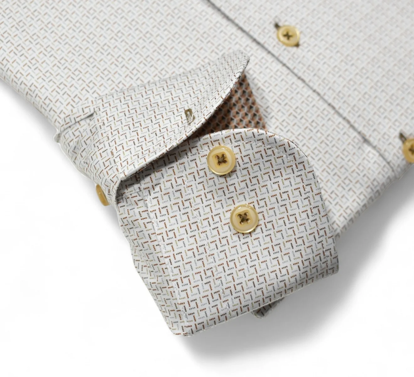 Close-up of a light gray textured shirt with rolled-up sleeves and wooden buttons on a white background