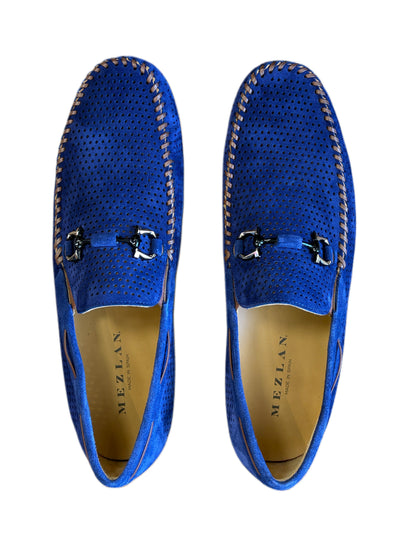 The Mezlan Tarraco Loafer is a blue men's moc toe perforated suede loafer featuring metal horsebit details, stitched edges, and signature Mezlan branding.
